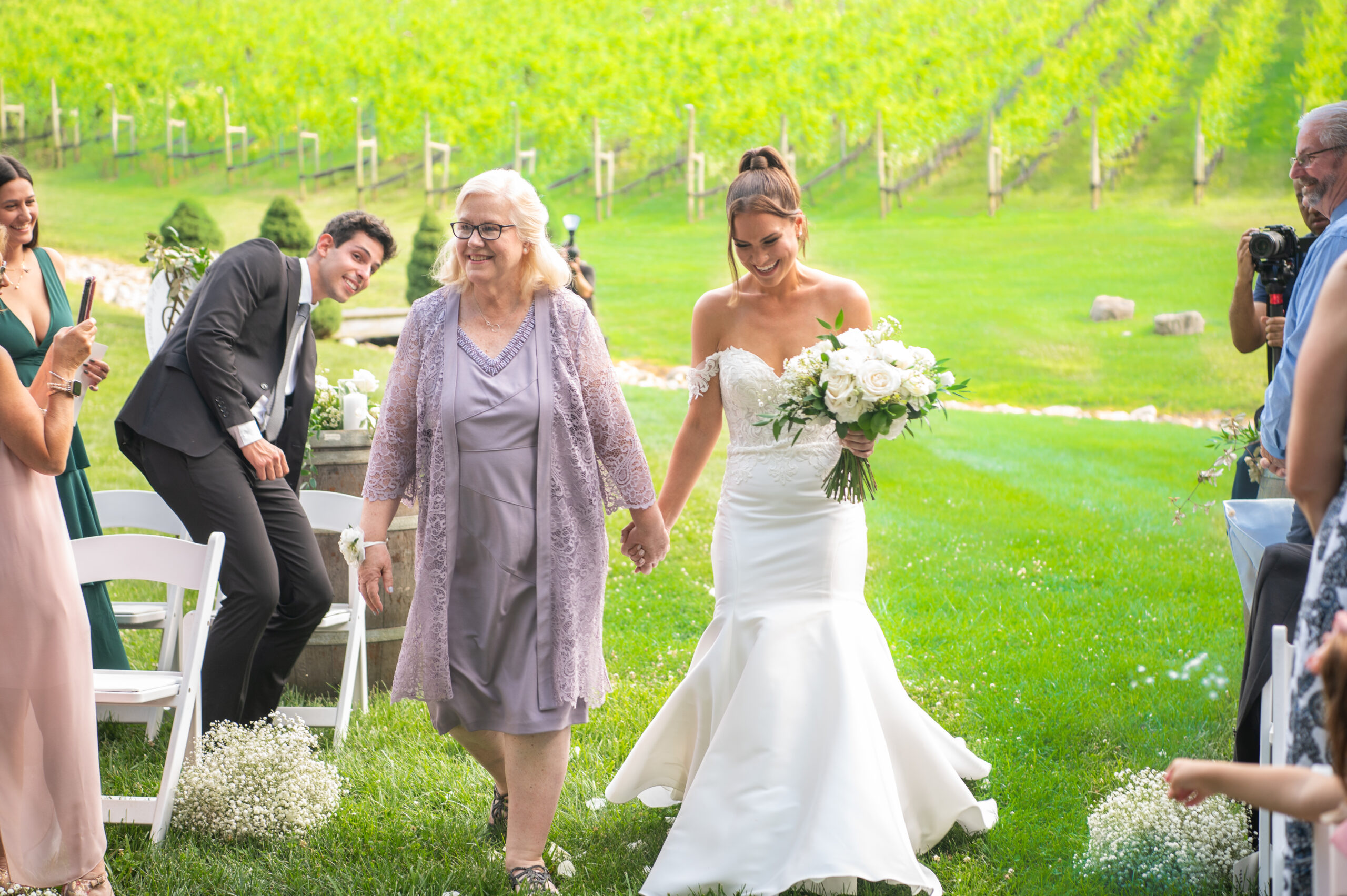 Bride and Mom down aisle